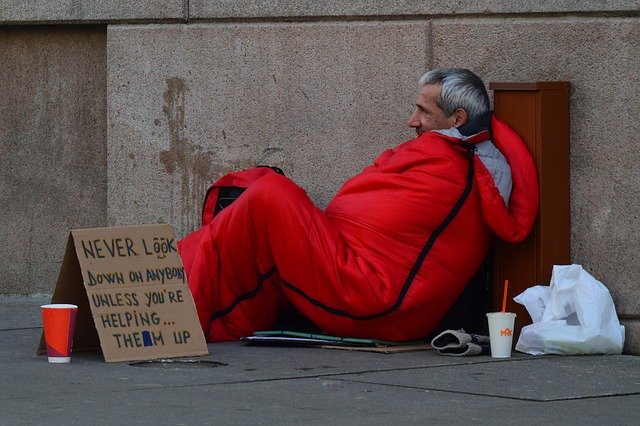 Homeless man with sleeping bag