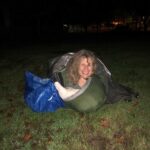 Smiling lady sleeping out