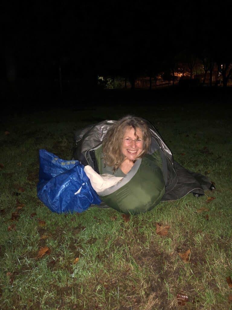 Smiling lady sleeping out