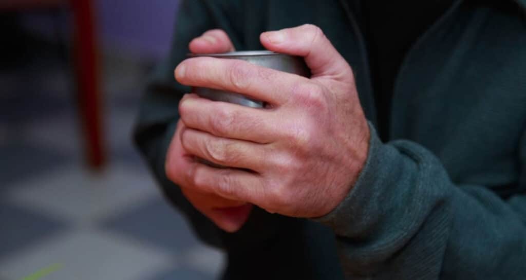 Male cupped hands keeping warm
