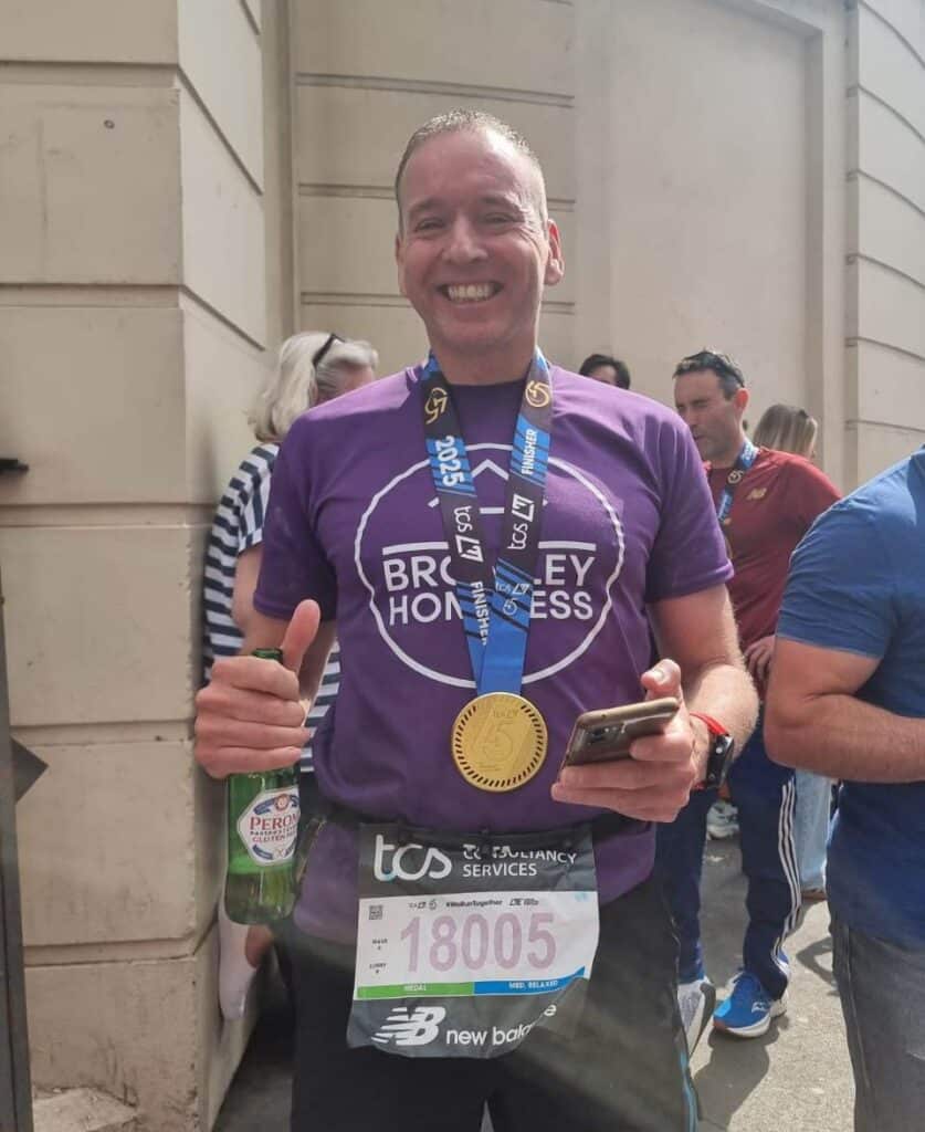 Mark with his medal after running the London marathon