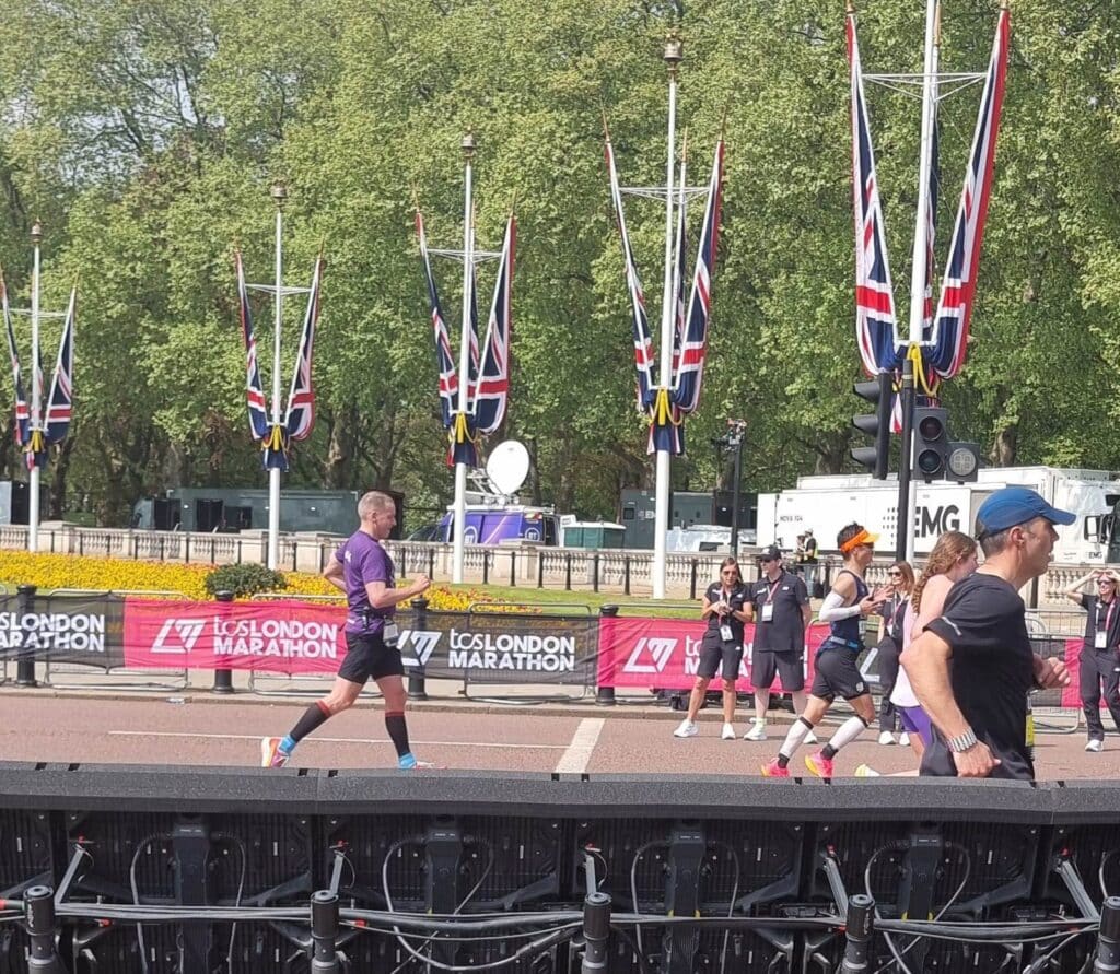 Mark our London Marathon runner crossing the finish line